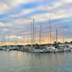 boats on the river at sunset in Mystic