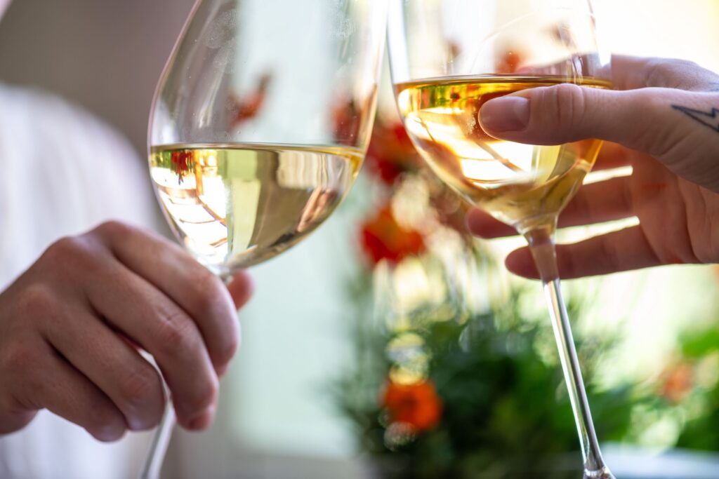 couple drinking white wine at wineries near Mystic CT