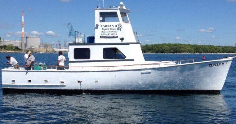 Tartan II open boat for bottom fishing sailing on the water with people fishing on deck.