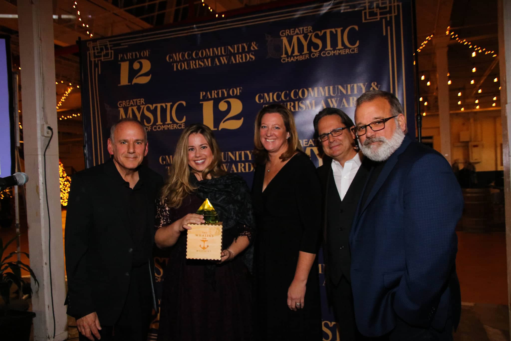 Greater Mystic Chamber of Commerce posing with award