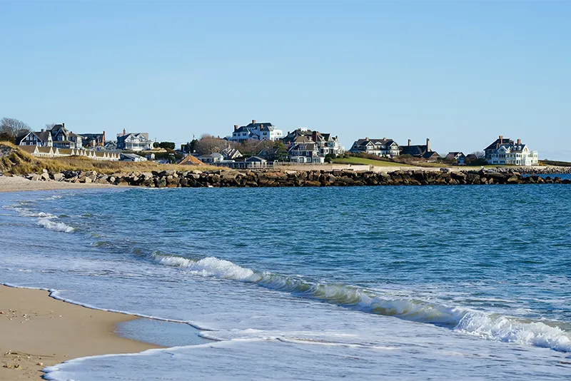 Scenic coastal landscape featuring luxury beach houses overlooking the blue ocean in Chatham, Cape Cod, Massachusetts.