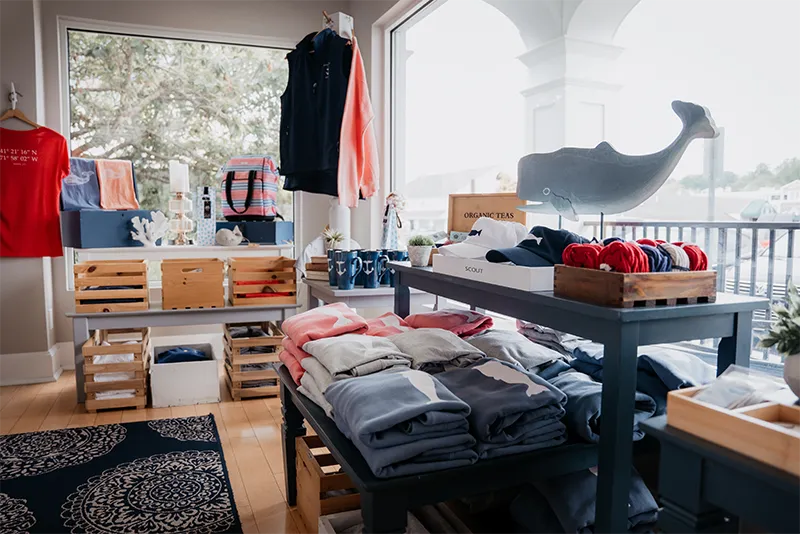 Coastal-inspired boutique shop featuring nautical apparel, accessories, and home decor displays.