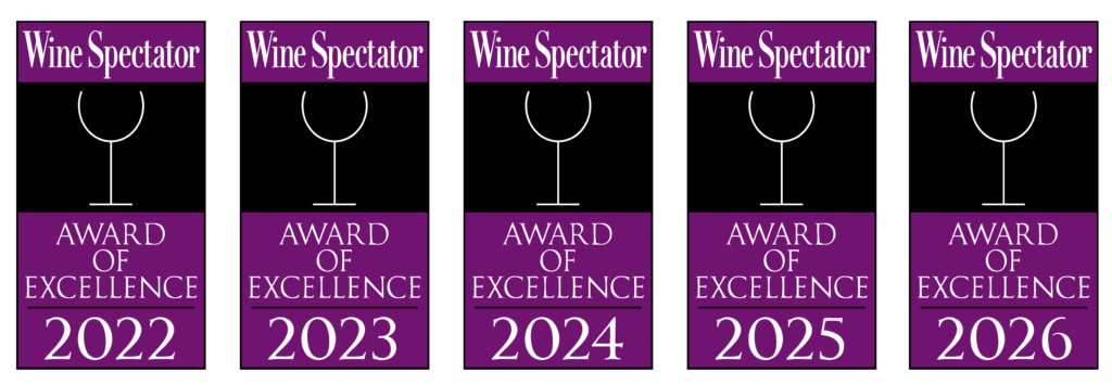 Five Wine Spectator Award of Excellence emblems for the years 2022, 2023, 2024, 2025, and 2026